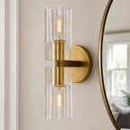 Arcachon Brass Double-Head Wall Sconce beside a mirror