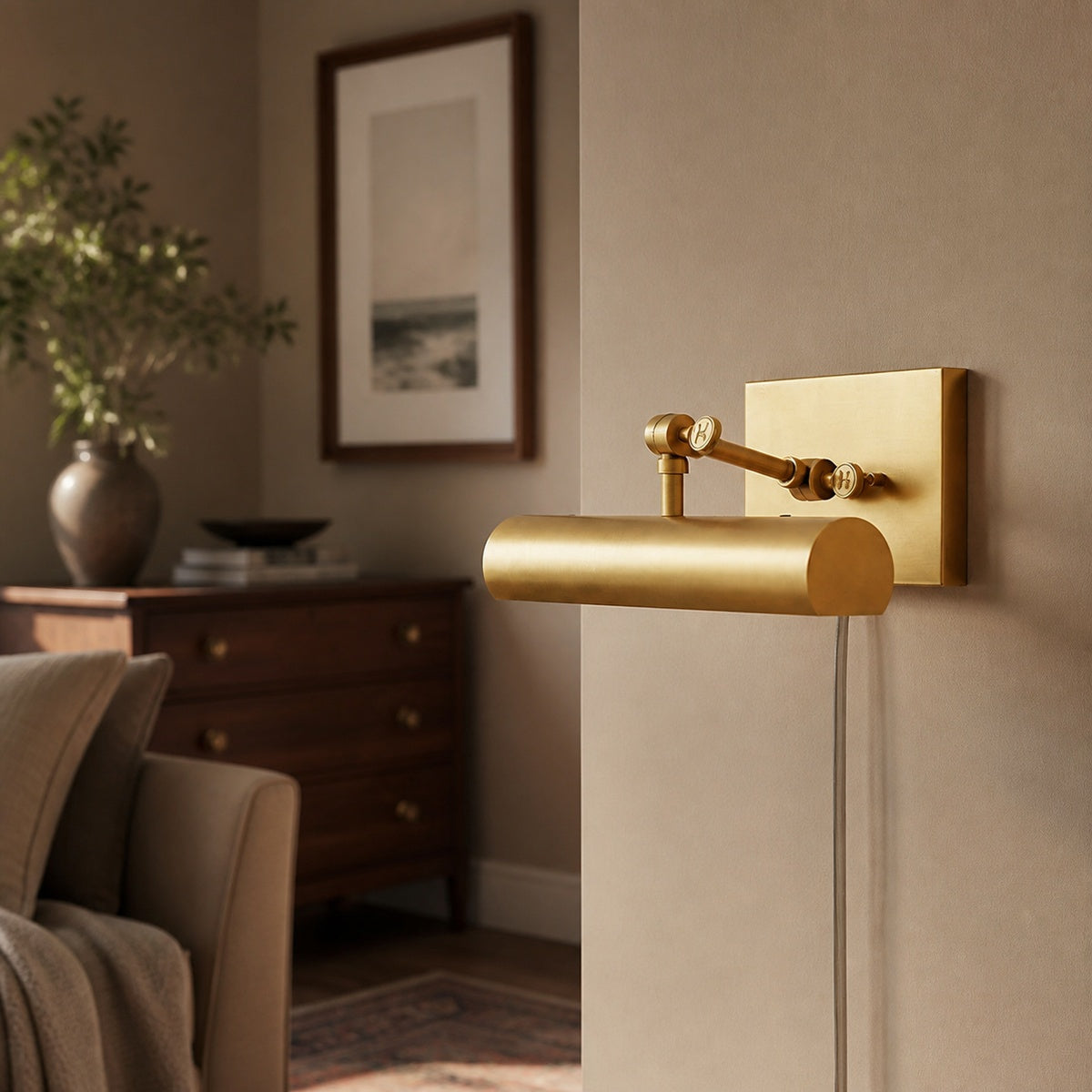 Hinkley Stokes Brass Plug-In Picture Light in a warm interior