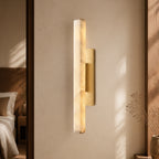 Audubon Alabaster Single Sconce in a warm bedroom interior
