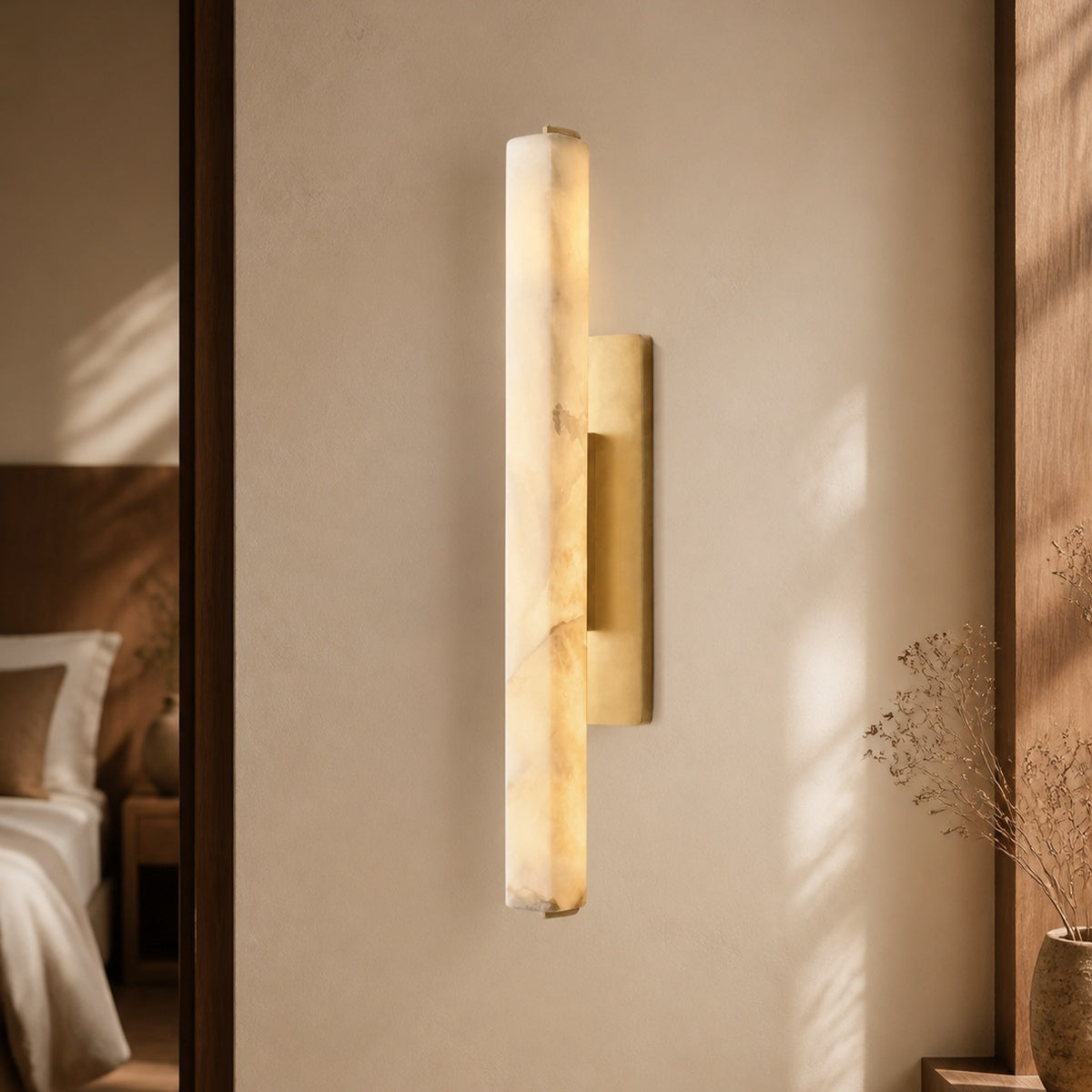 Audubon Alabaster Single Sconce in a warm bedroom interior