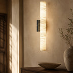 Modern Luxury Vertical Alabaster Wall Sconce in a warm hallway interior