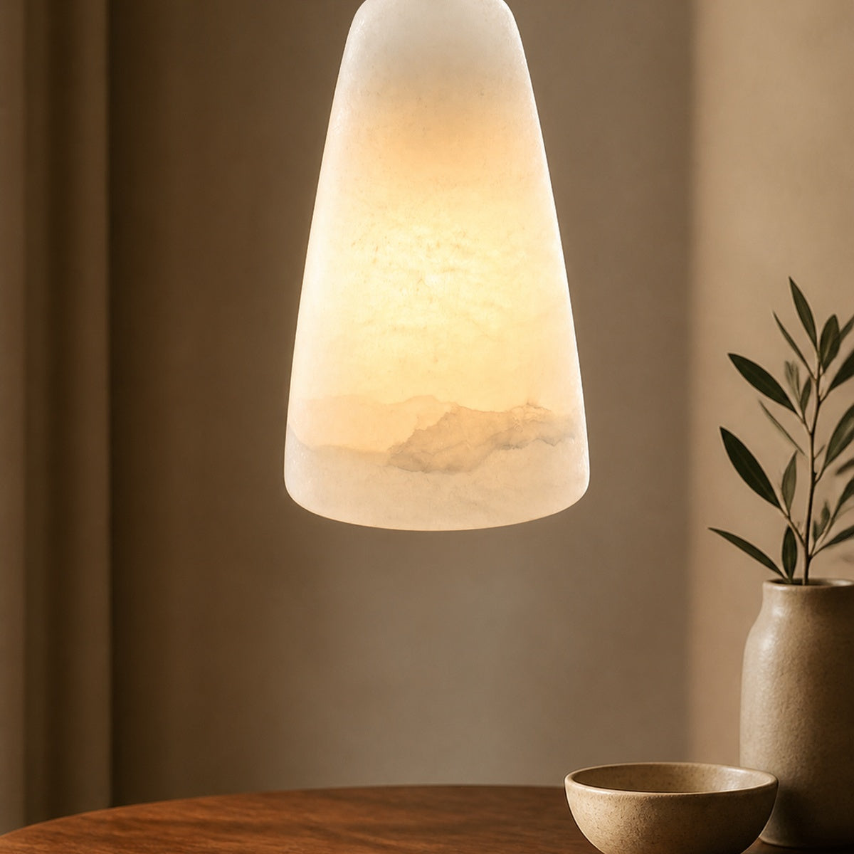 Modern Belfry Pendant Light in a warm dining interior
