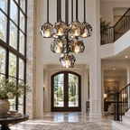 Boule De Cristal clear and smoke cluster chandelier installed in a double-height villa foyer