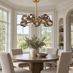 Boule De Cristal 24-inch round chandelier above a villa dining table