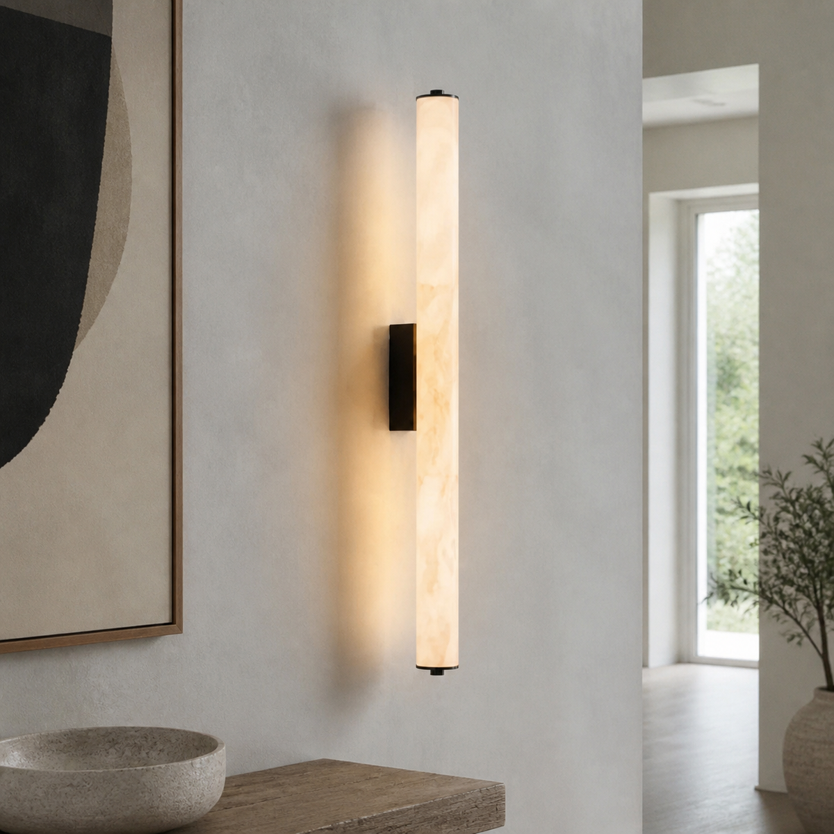 Delos Cylindrical Marble Wall Sconce installed in a modern hallway