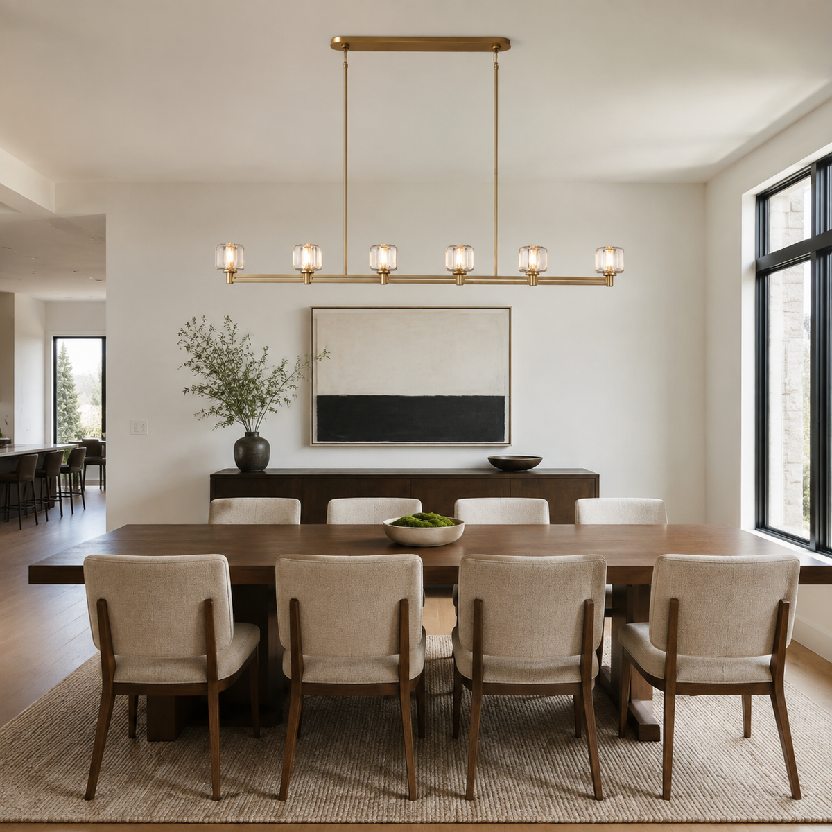 Demaret Linear Chandelier installed above a long dining table