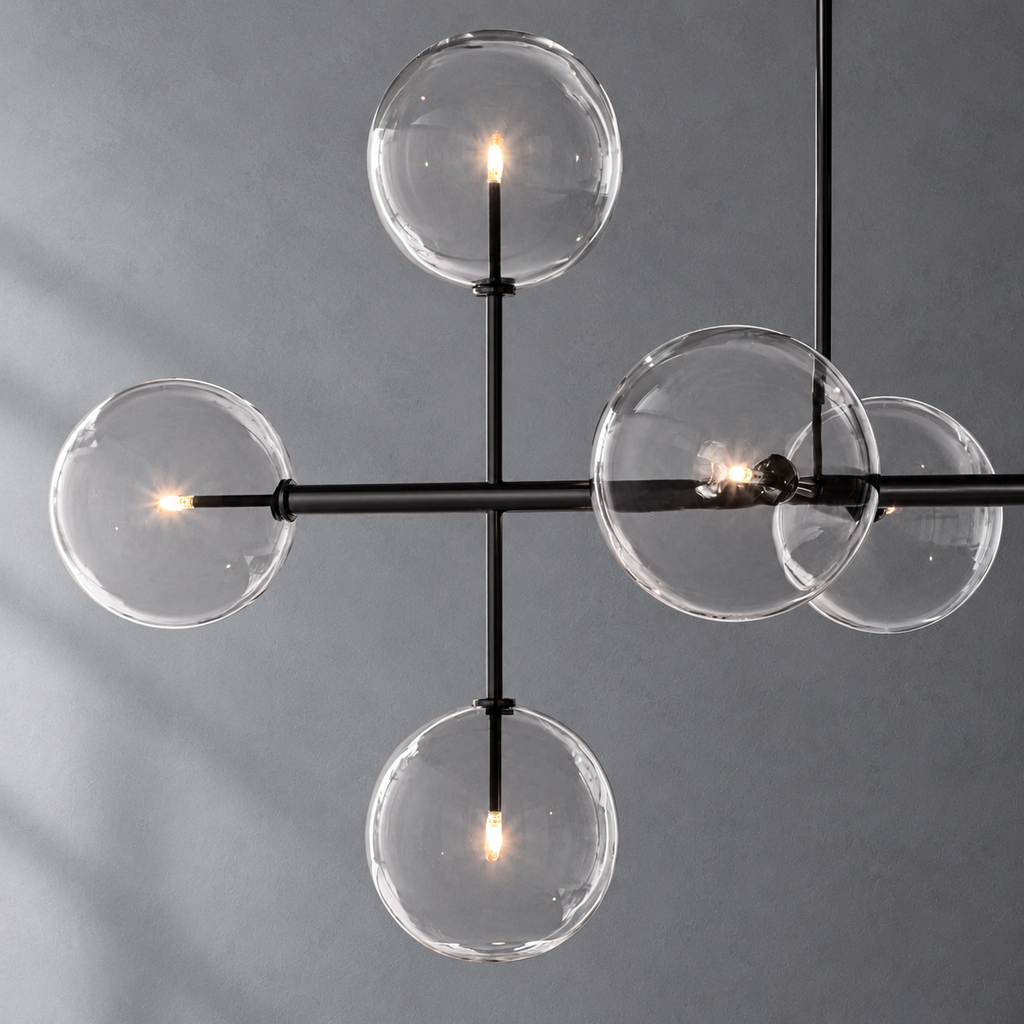 Sierra 72-inch matte black linear chandelier glass globe and metalwork detail on a textured gray background