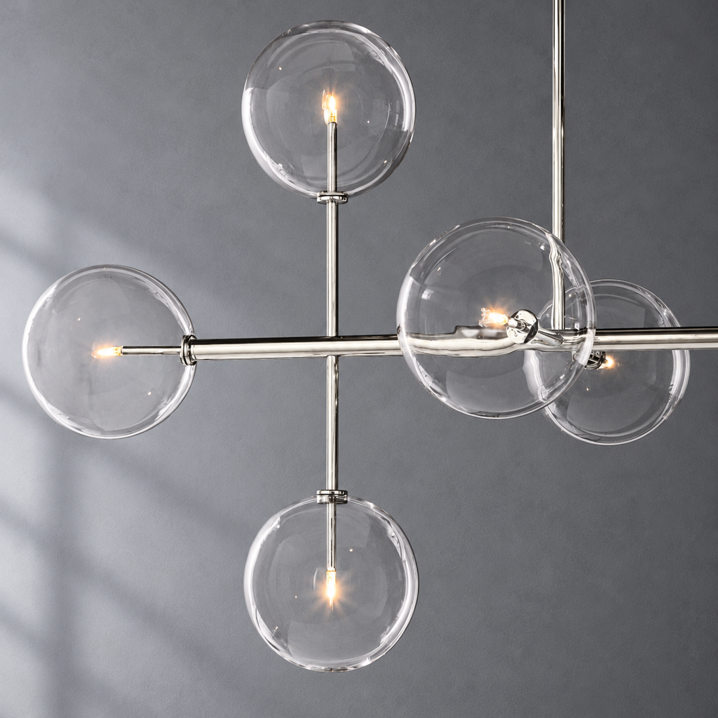 Sierra 72-inch polished nickel linear chandelier glass globe and metalwork detail on a textured gray background