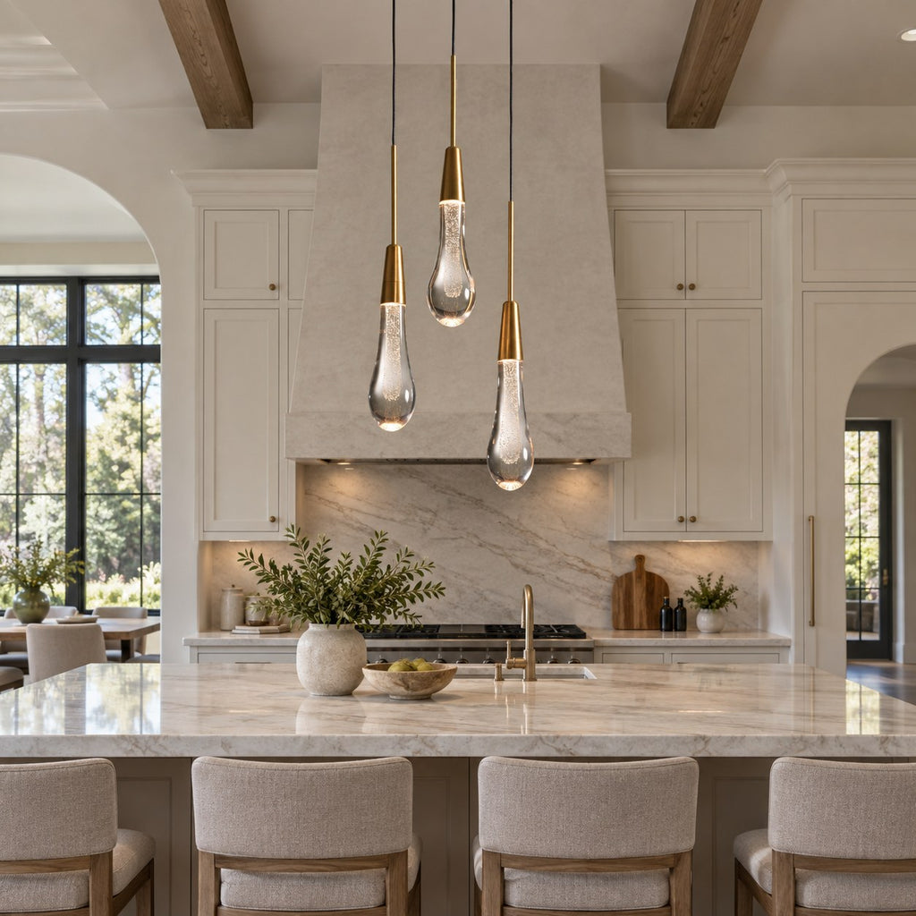 Solitaire three-light crystal pendant above a villa kitchen island