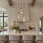 Solitaire three-light crystal pendant above a villa kitchen island