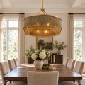 Tissot large antique-brass chain-fringe chandelier in a dining room