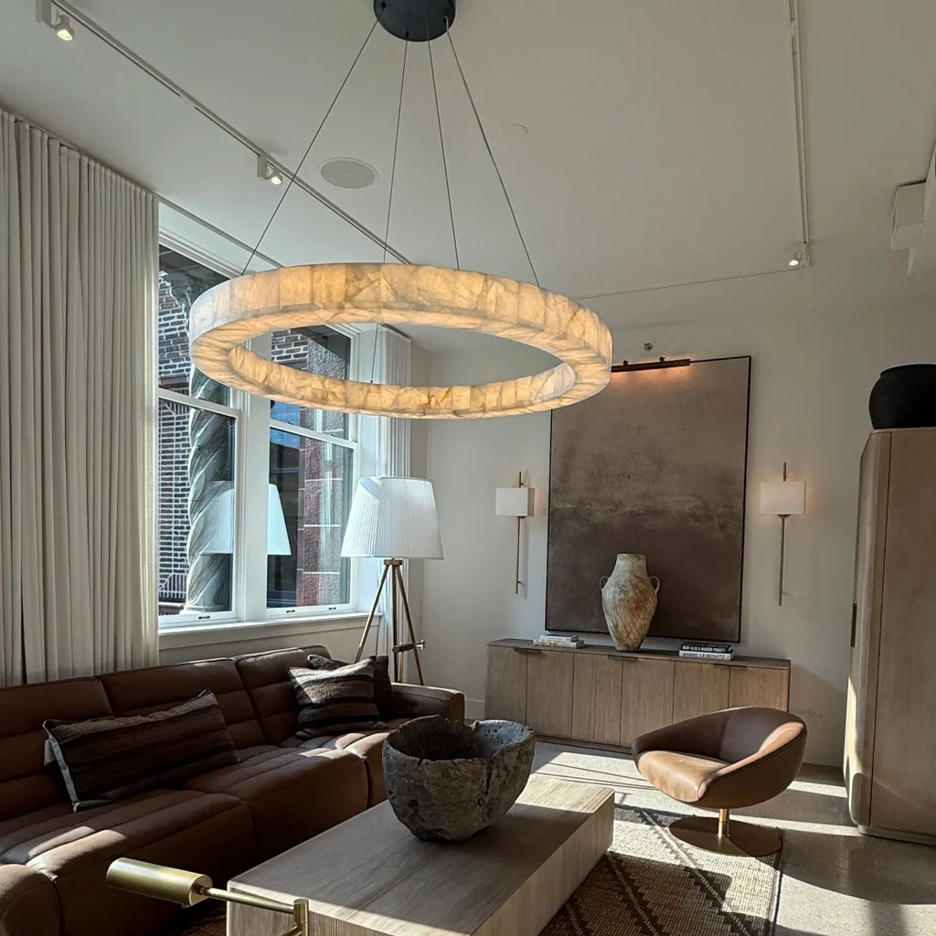 Customer installation of an illuminated ring chandelier in a modern living room