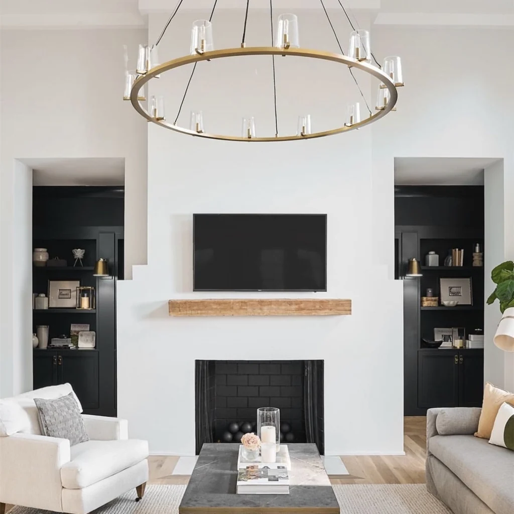 Customer installation of a brass ring chandelier in a living room