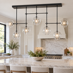 Fulcrum Glass Globe Mobile Linear Chandelier 60" in a naturally lit American villa interior